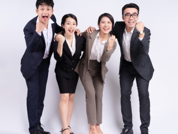 Group of Asian business people posing on a white background Group of Asian business people posing on a white background
